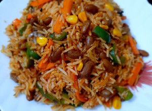 A picture of Mexican Rice with Red Sauce.