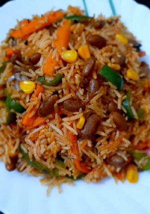 A picture of Mexican Rice with Red Sauce.