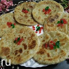 A picture of Moong dal paratha Moong dal ki puran puli Pesarapappu bobbatlu.