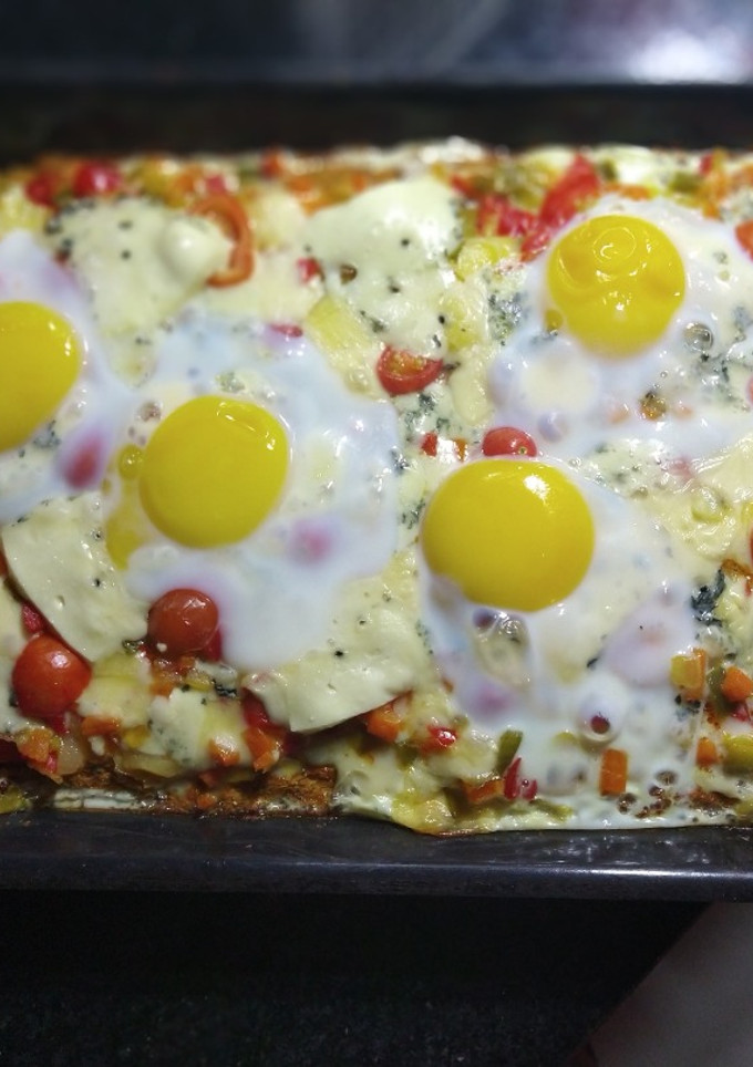 Una foto de Pizza con masa de zanahoria