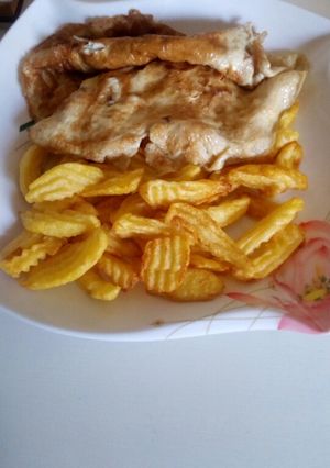 A picture of Fried chips with egg.