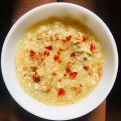 A picture of Ginger Chicken Porridge with Curry Spices • Curried Arroz Caldo • Spiced Congee.