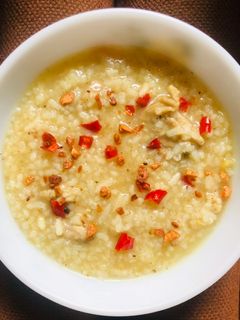 A picture of Ginger Chicken Porridge with Curry Spices • Curried Arroz Caldo • Spiced Congee.