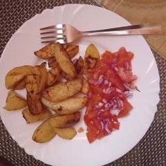 A picture of Baked potatoes with kachumbari.