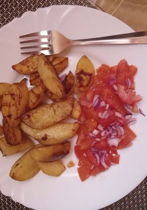 A picture of Baked potatoes with kachumbari.