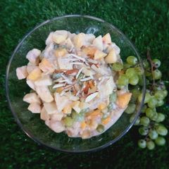 A picture of Yogurt fruit chat including banana 🍌 apple 🍎 peaches 🍑.