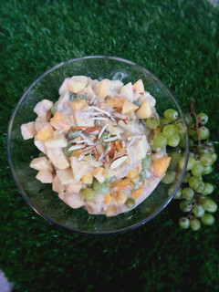 A picture of Yogurt fruit chat including banana 🍌 apple 🍎 peaches 🍑.
