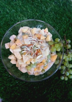A picture of Yogurt fruit chat including banana 🍌 apple 🍎 peaches 🍑.
