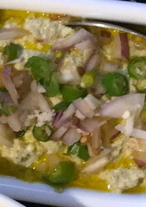A picture of Posto Bhapa (Steamed Khus-Khus), with Mustard Oil.