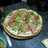 Pizza de rúcula y jamón crudo 