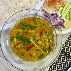 A picture of My best-ever Chicken and Sohanjana phali (moringa) curry in coconut milk.