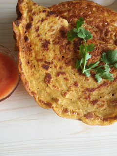 A picture of Moong and cherra pitha.