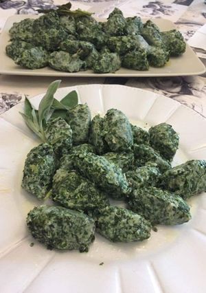 A picture of Gnudi with Swiss Chard and Ricotta.