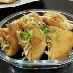 A picture of Johnny one one(mandazi and samosa).