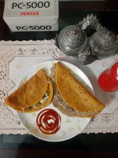 A picture of Stuffed besan chilla.