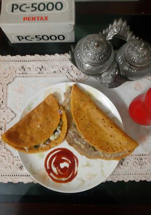 A picture of Stuffed besan chilla.