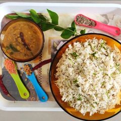 A picture of Jeera rice and dal tadka.