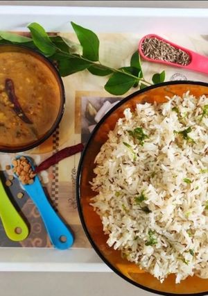 A picture of Jeera rice and dal tadka.