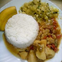 A picture of Coconut rice served with beef stew and cabbage.