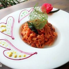 A picture of Fetochini pasta with mix souce.