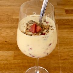 A picture of Vanilla milkshake with roasted strawberries.