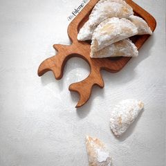 A picture of Persian Qottab (Traditional Persian Filled Pastry).