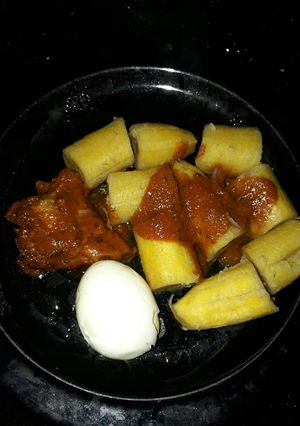 A picture of Boiled plantains and egg turkey stew.
