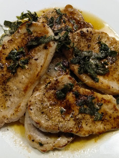 A picture of Pork Chops with Crispy Herbs.