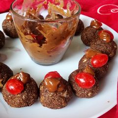 A picture of Choco Halwa Balls with Chocolate Sauce.