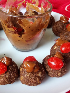 A picture of Choco Halwa Balls with Chocolate Sauce.