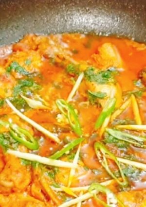 A picture of Red chicken curry/gravy.