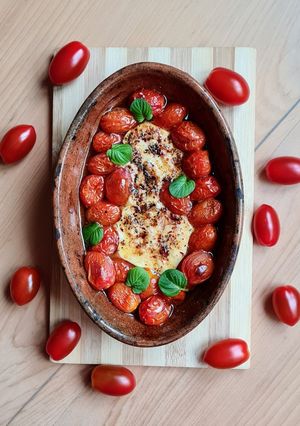 Una foto de Tomates cherry asados con provoleta de leche de búfala