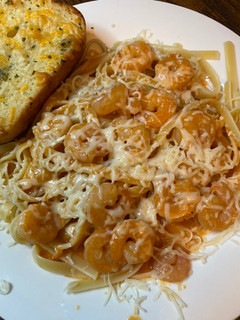 A picture of Shrimp fettuccine with red pepper sauce.