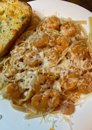 A picture of Shrimp fettuccine with red pepper sauce.