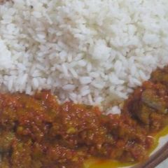 A picture of White rice and beef stew.