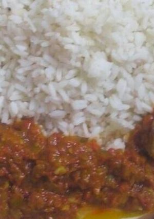 A picture of White rice and beef stew.