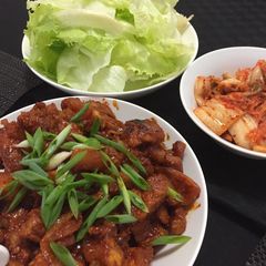A picture of Pork belly in spicy korean sauce.
