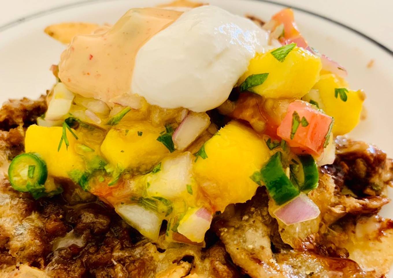 Loaded Nachos with Mango Salsa, Sour cream and cheese sauce
