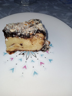 A picture of Chocolate Sauce Slmond Vanilla Cake.