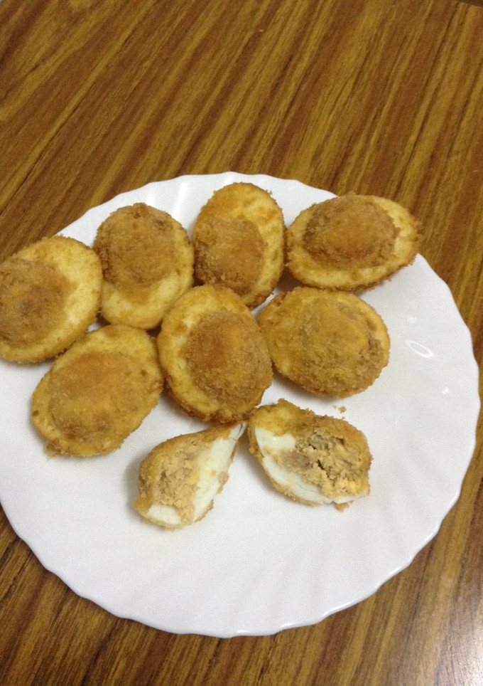 Una foto de Huevos rellenos fritos