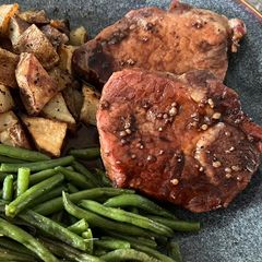 A picture of Pork Chops with Pomegranate Sauce.