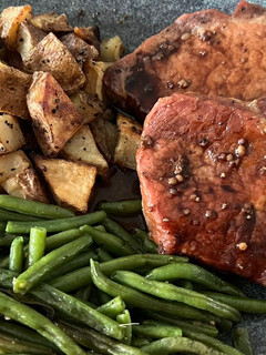 A picture of Pork Chops with Pomegranate Sauce.