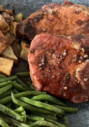A picture of Pork Chops with Pomegranate Sauce.