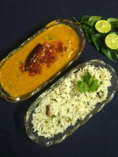 A picture of Dal tadka and jeera rice.