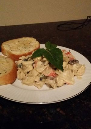 A picture of Brad's seafood tortillini in white wine alfredo.