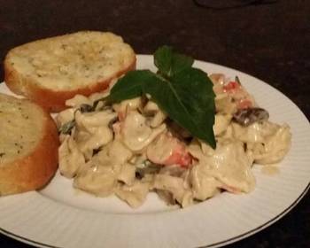 Unique Cuisine Brads seafood tortillini in white wine alfredo Very Delicious