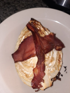 A picture of Baked cabbage and bacon.