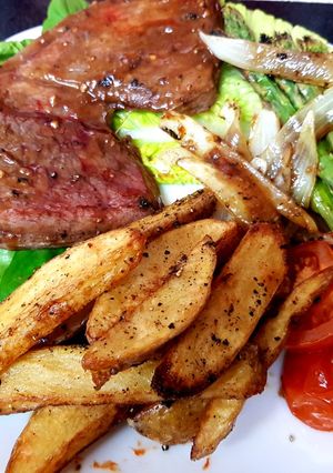 A picture of My Peppered Marinated Steak with Onions garlic, Wedge Chips. 😘.