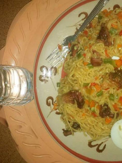 A picture of Indomine with carrots,green peas and boiled eggs.