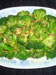 A picture of Steamed broccoli with ginger and oyster sauce.